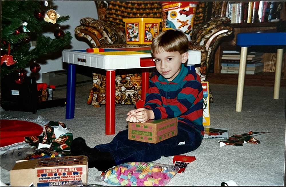 Adrian as a child on Christmas morning